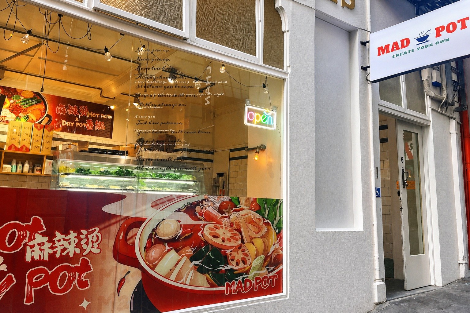 Mad pot storefront on Durham Street East in Auckland CBD with the Mad pot sign and Chinese window signage