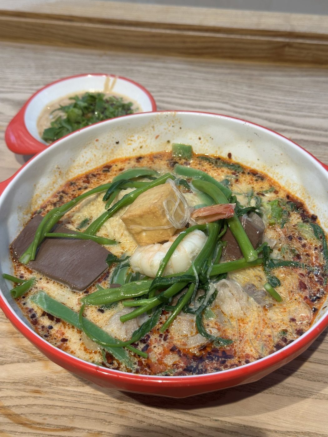 Mad pot mala soup bowl with prawns, noodles, vegetables and meatballs
